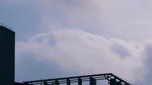 Looking On Cloudscape Over Structures During Sunny Day. - Timelapse
