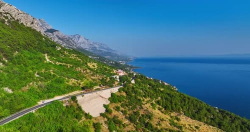 Drone following a coastal road on the Makarska riviera summer day in Croatia