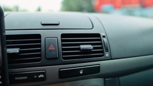 A Detailed Closeup View of the Car Dashboard Controls and Air Vents Presented in Stunning Resolution