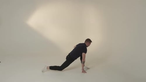 Young Adult Demonstrates Straddle Stretch and Lunges
