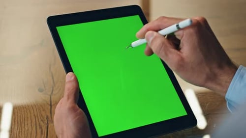 Artist Hand Drawing Stylus on Chromakey Tab Display Closeup. Creative Business Man