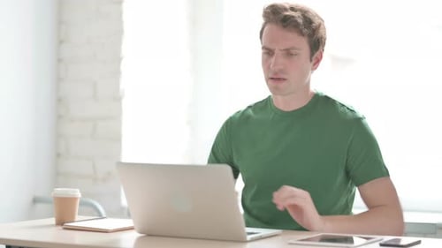 Man with Back Pain Working at Computer