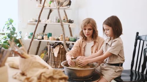Woman and Child Making Pottery Together