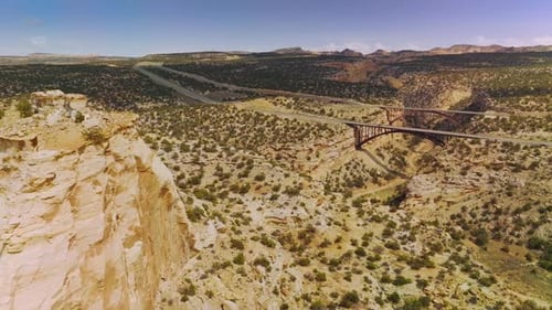 Flying close to the top of the rock in desert.