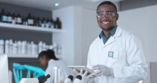 Scientist Holding Tablet in Modern Laboratory