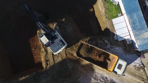 Aerial Video of Excavator Preparing Ground for Building Project