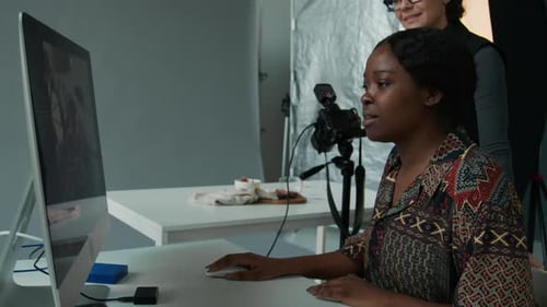 Food Stylist and Photographer Discussing Reference Image