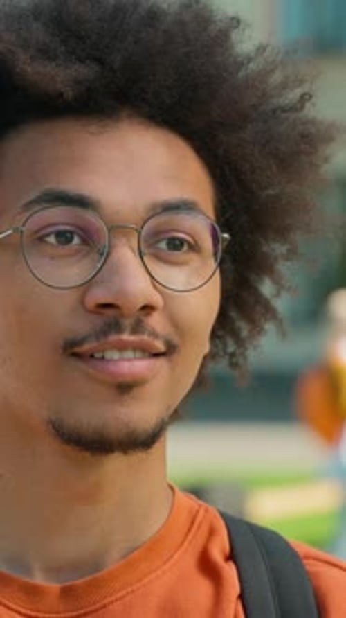 Happy Smiling African American Male Student Looking at Camera University Outdoor Background Students