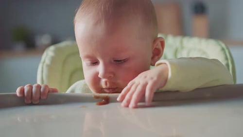 Adorable Infant Eating and Making a Mess
