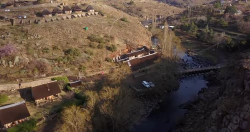 Landscape, river and village in countryside from drone with natural environment