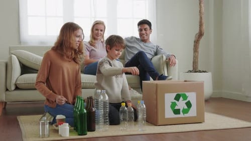 Family Sorting Recycling in a Bright Home