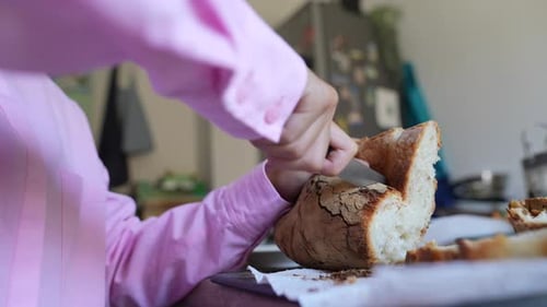 Slicing Fresh Bread Loaf in Home Kitchen