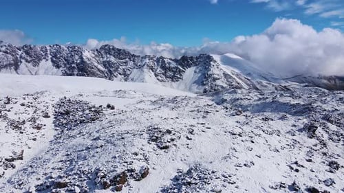 Aerial View of the Mountain Slopes Covered with Fresh Snow