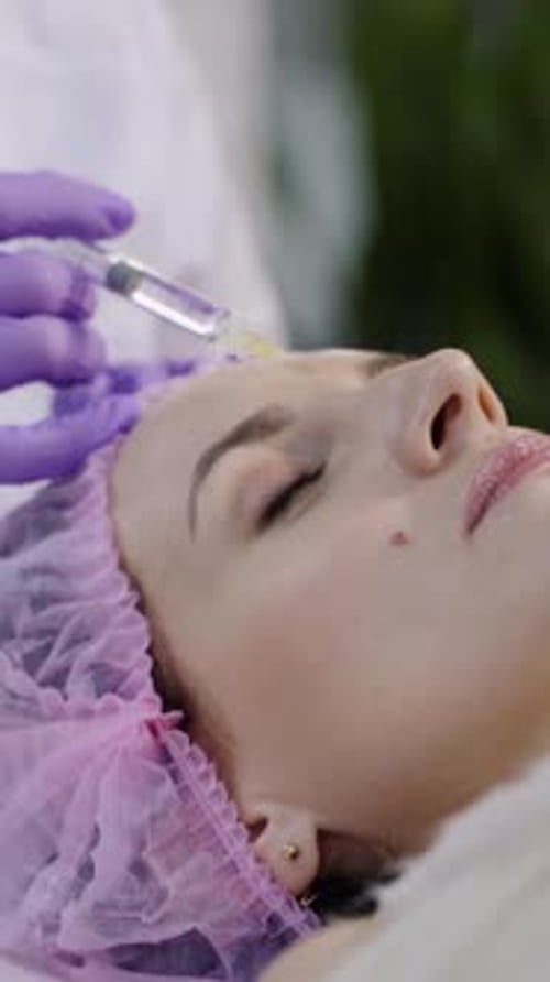 Woman Receives Cosmetic Procedure in Clinic