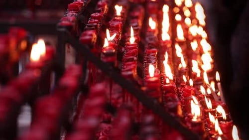 Rows of candles in a church or temple.