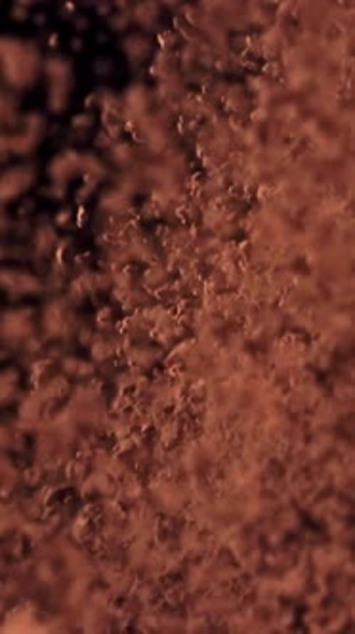 The Cocoa Powder Flies Up and Down Filmed on a Highspeed Camera at 1000 Fps