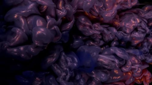 Abstract Shot of Colorful Ink Swirling on Black