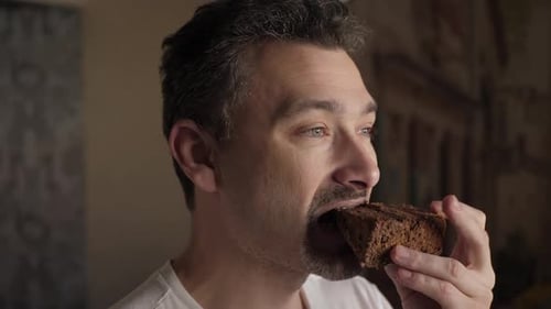 Adult Male Eating Brownie Piece, Close Up