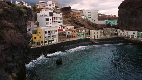 Waterfront Homes Nestled Between Boulders in a Small Village