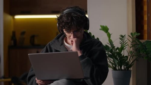Concentrated Caucasian Guy Working Laptop at Home Man Freelancer Programmer Chatting Website