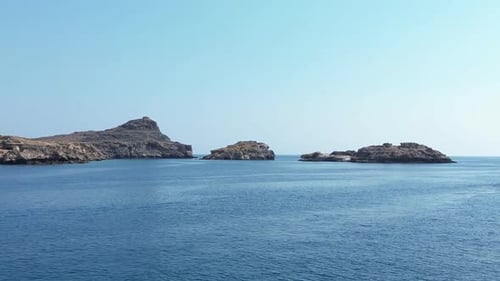 Tour Boat Sailing Near Rocky Greek Islands
