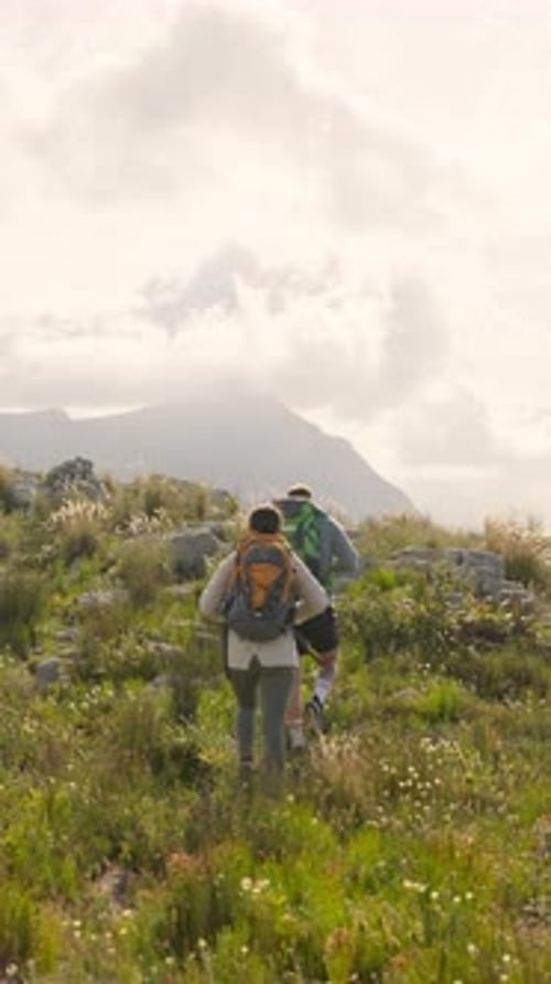 Back, couple and trekking on mountain for adventure date, tourist exploration and bonding together