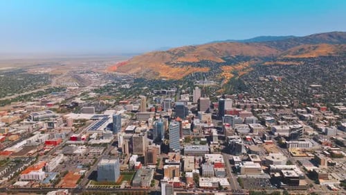 Sunny view of the city with beautiful densely built architecture. Salt Lake City panorama