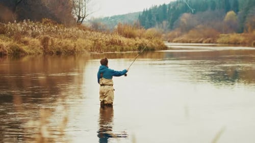 Autumn Fly Fishing Amateur Fisherman Casts the Fly in Slow Motion