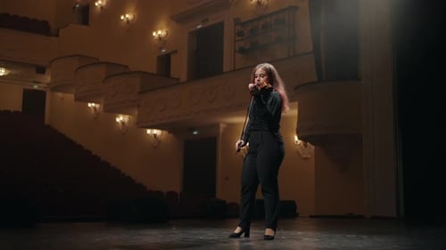 Portrait of Young Female Violin Player is Playing Fiddle in Music Hall Woman Violinist in Opera