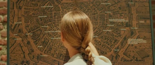 Woman Consults Historical City Map