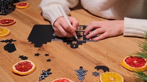 Woman Crafting Christmas Decoration on Wooden Table