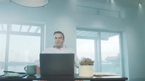 Business Man Stretching Body in Home Office. Tired Man Relaxing at Remote