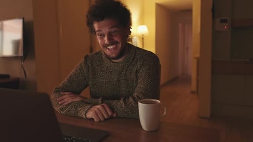 Young Adult Enjoying Video Call at Home