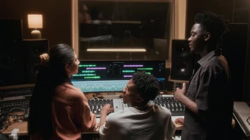 Musicians Working on New Tracks in Recording Studio