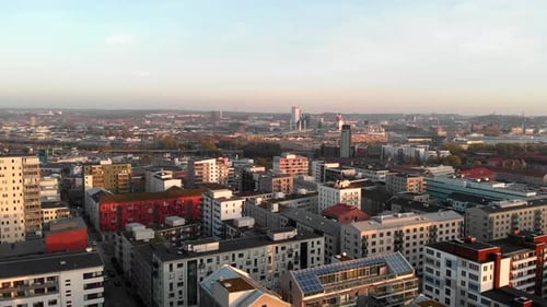 Aerial flyover nordic Residential complex of buildings during sunset lights, Hisingen, Gothenburg