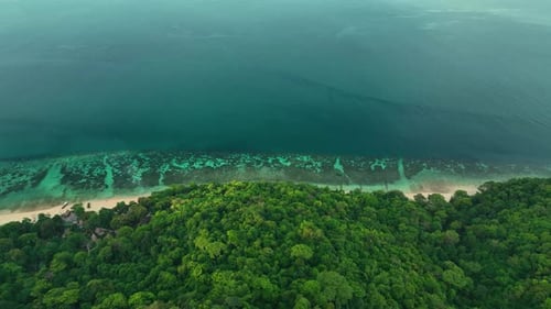 Aerial view of tropical island and turquoise sea, Thailand.