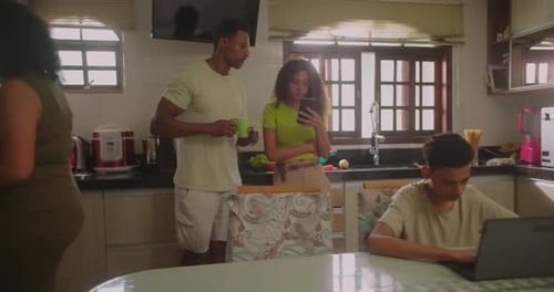 Family Scene in Kitchen at Home During Daytime