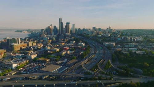 Seattle, Washington, United States. Aerial drone flight towards Seattle skyline at sunrise.