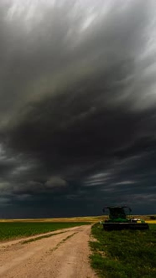 Green Farm Tractor on a Countryside Road