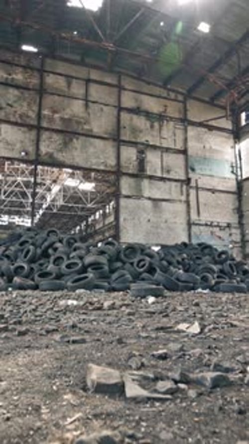 Empty Storehouse Interior For Background. Industrial abandoned building interior in dark colors