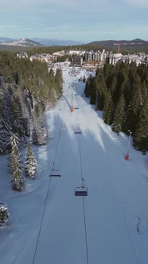 Alpine Ski Lift Aerial Drone View in Kopaonik Serbia Chairlift at Ski Resort Mountain Winter Forest