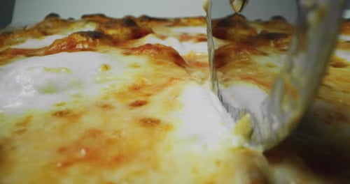 Pizza Cutter Cutting Fresh Made Pizza Close Up