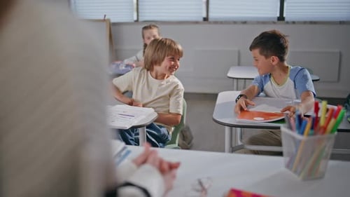 Curious Kids Enjoying Lesson at Class Room Boys Talking Each Other at School