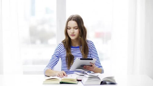 Teen Girl Studying with Tablet and Books