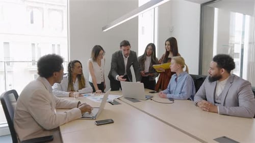 Business Team Discussing Data During Meeting
