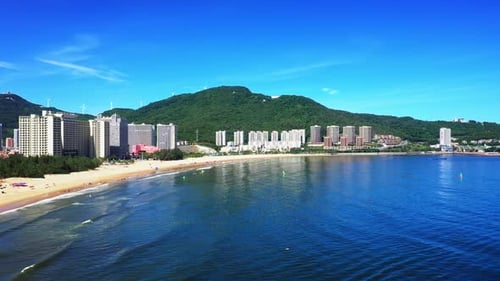 Aerial Top view of a transparent blue sea with beautiful waves at sunny day in summer. air of ocean