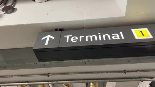 Terminal 1 sign with arrow in parking garage at Toronto Pearson YYZ airport