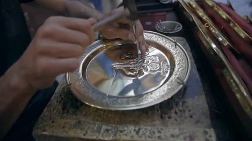 Artisan Engraves Design On Brass Silver Plate In Souq Market In Tunis, Tunisia. Closeup