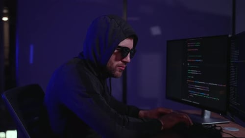 Person Types at Computer, Makes Shushing Gesture