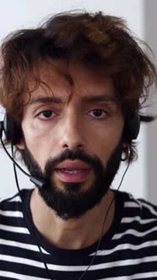 Man with Headset Talking to Customer Service